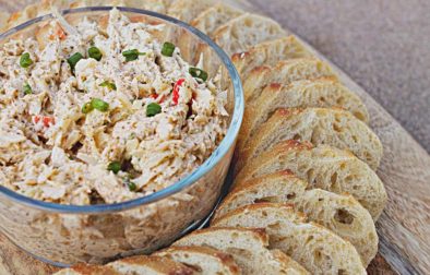 bowl of crab salad with french baguette slices